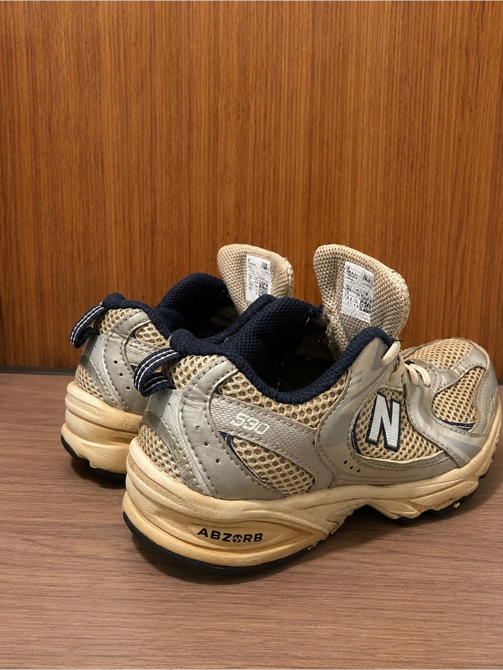 Used good New Balance Kids Beige and Navy 590 Sneaker